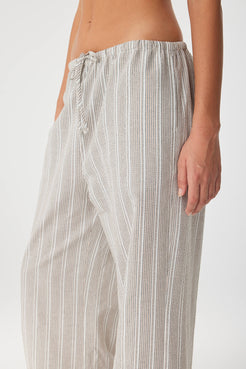Close-up of drawstring waist and side seam pocket in lightweight striped cotton.