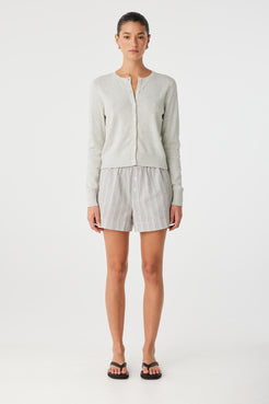 Full-body view of matching striped cotton set with Ines short and long-sleeve shirt.