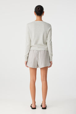 showcasing the relaxed boxer fit and drape of the cotton blend.