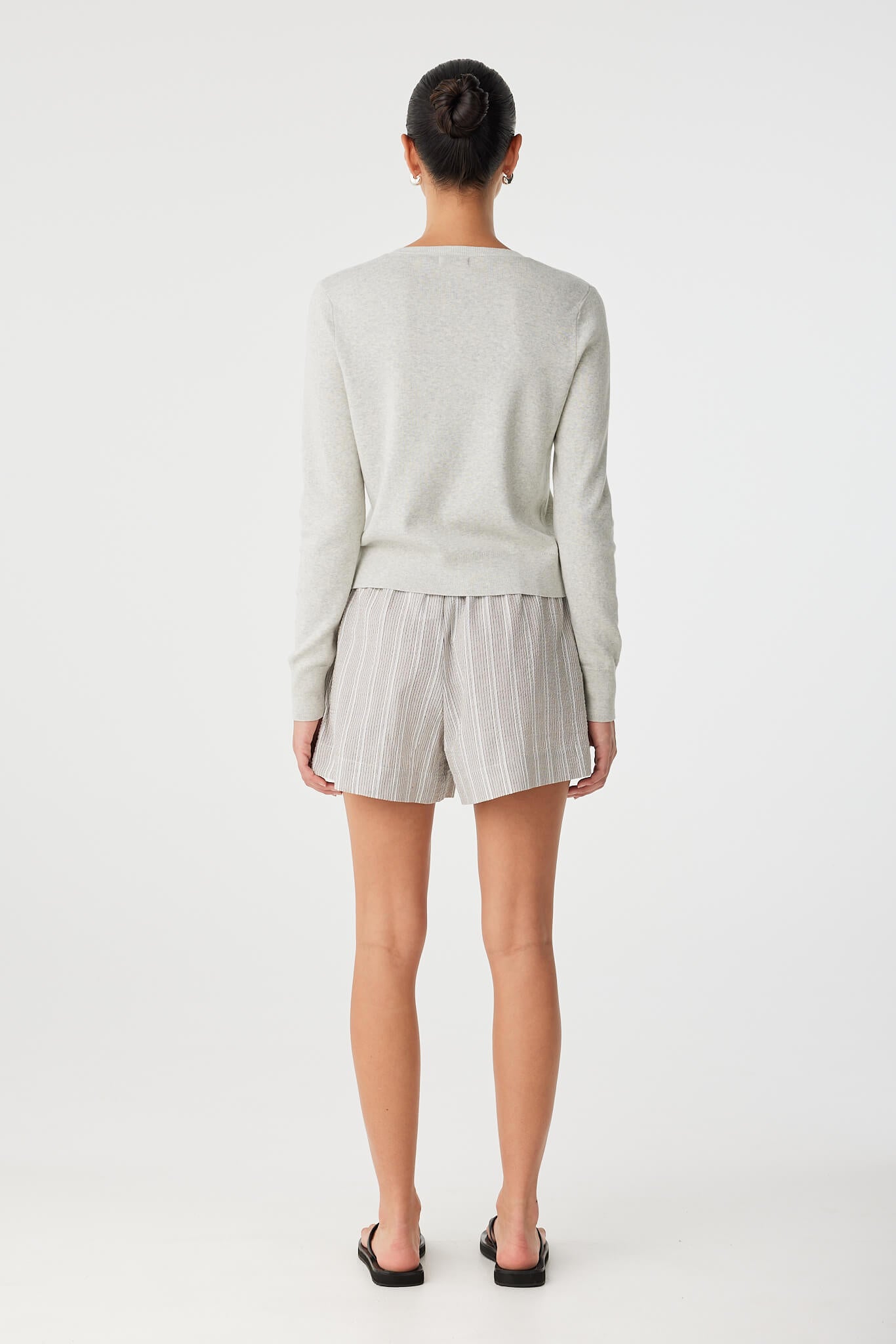 showcasing the relaxed boxer fit and drape of the cotton blend.