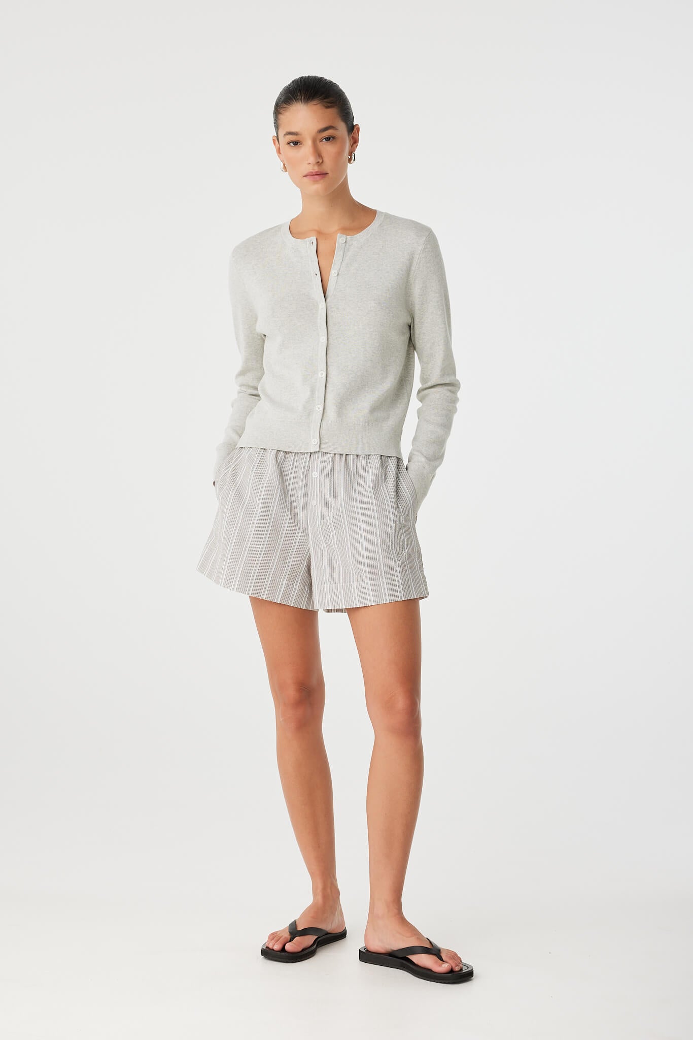Model wears Ines short with matching button-up shirt, styled for coordinated summer loungewear.