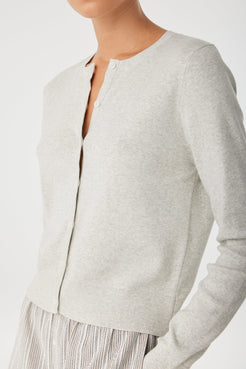 Close-up of neckline and premium smooth cotton knit on grey cardigan.