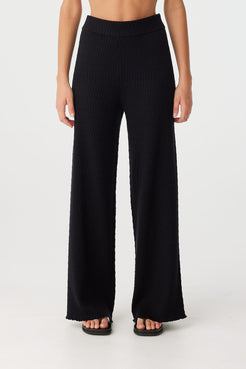 Front view of Jade straight leg pants in black organic cotton with textured knit and clean silhouette.