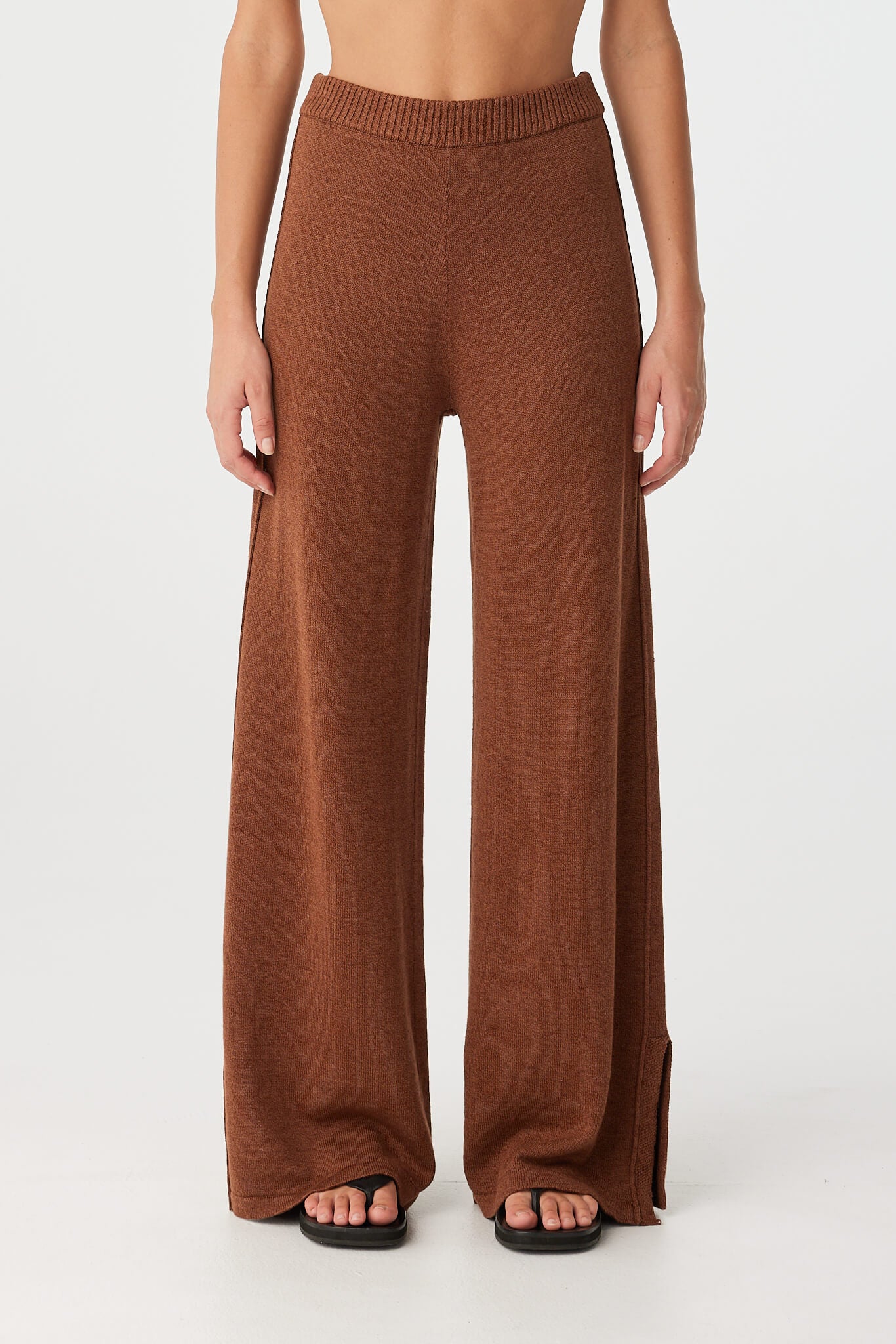 Front view of wide-leg knit pant in clay with elastic waistband and soft drape.