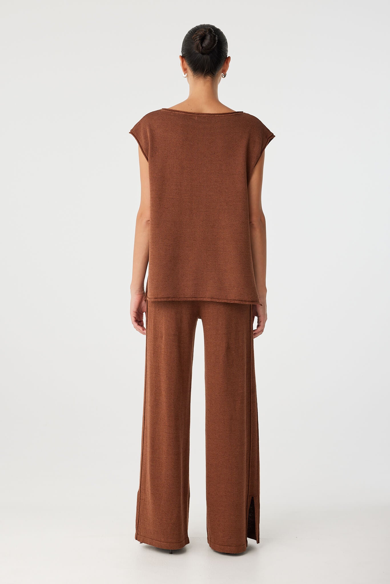 Full back view of coordinated knit set in clay, showing soft volume and relaxed styling.