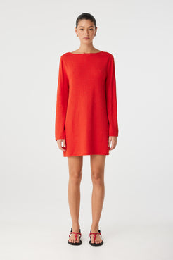 Front view of Paloma Dress worn with high neckline and clean finish, showing soft structure in cherry red textured weave.