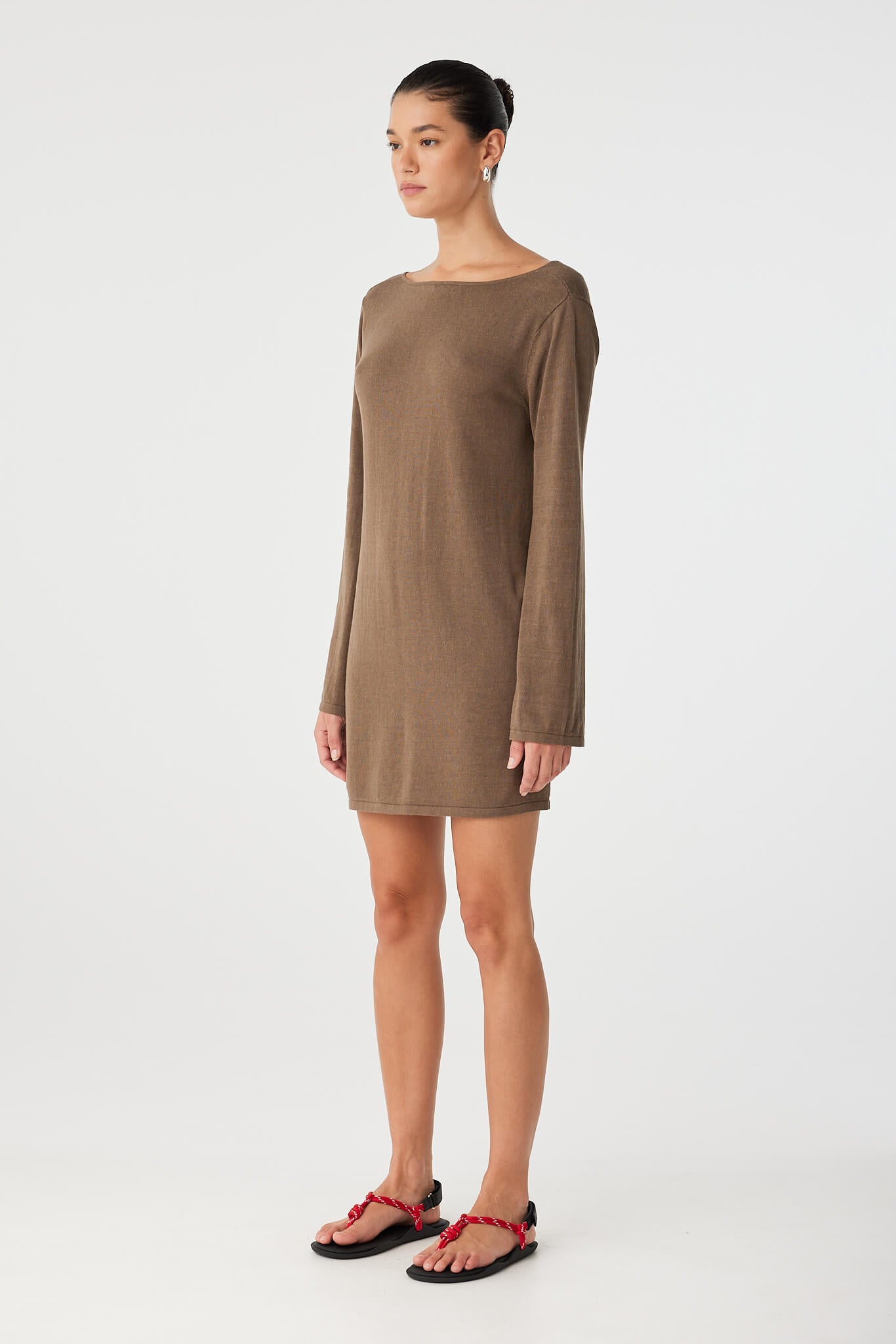 Side view of boat neck linen dress with relaxed fit and subtle texture.