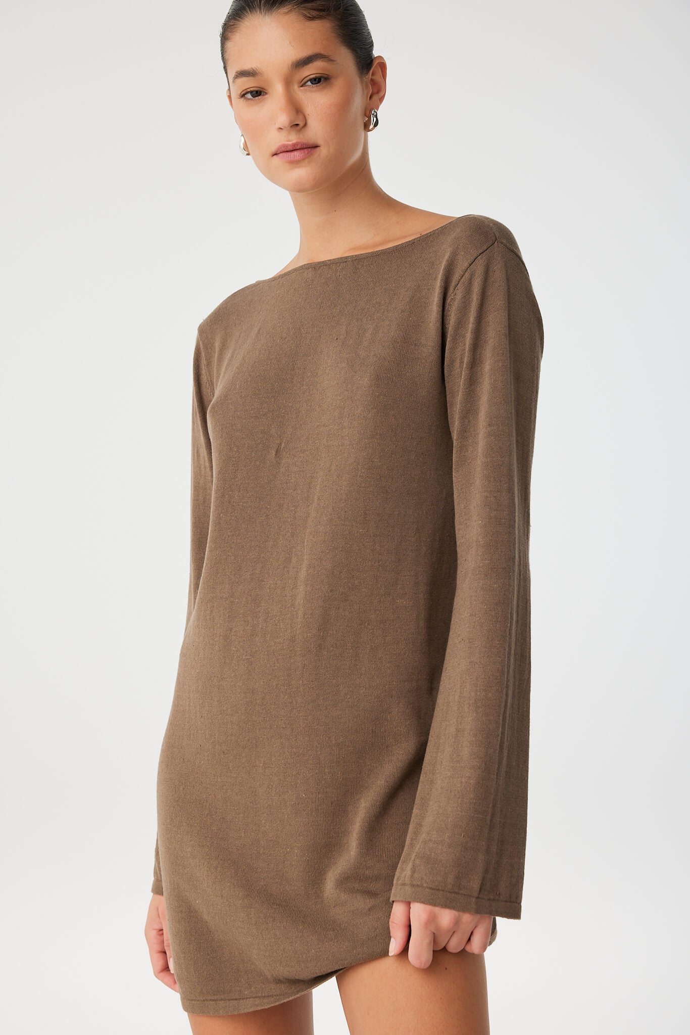 Close-up of cacao linen–cotton texture and long sleeve fit.