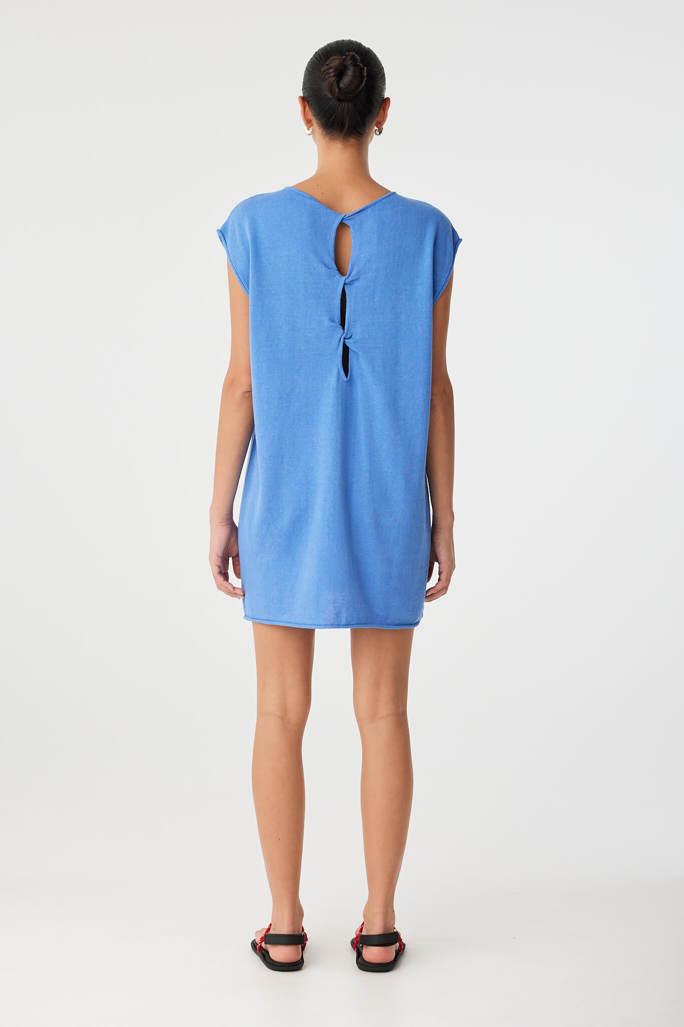 Back view of Pala Dress worn with twist cut-out at upper back—reversible design offers two looks in one, ideal for minimal wardrobes.
