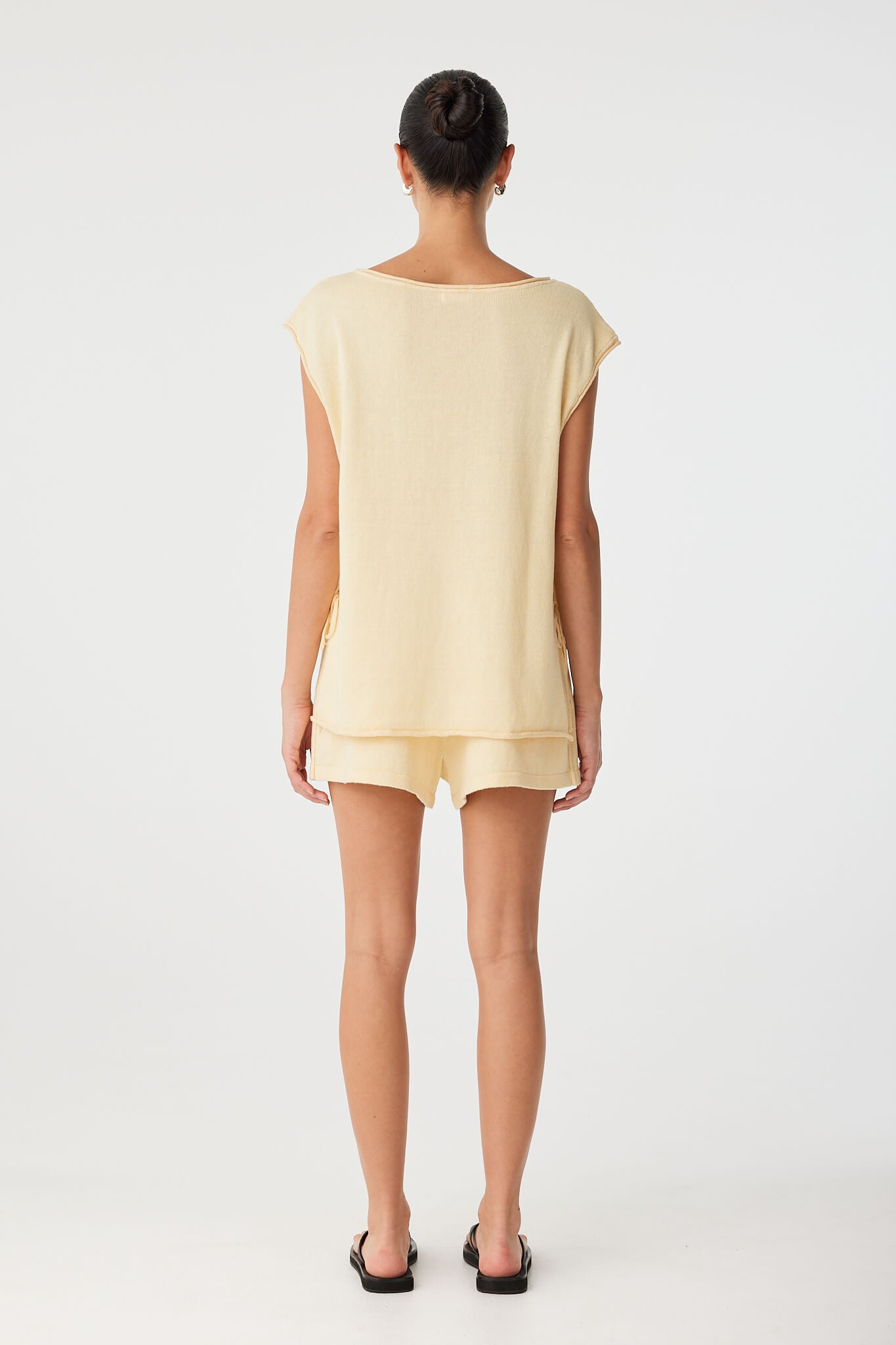 Back view of linen–cotton blend top in butter, with loose, airy shape.