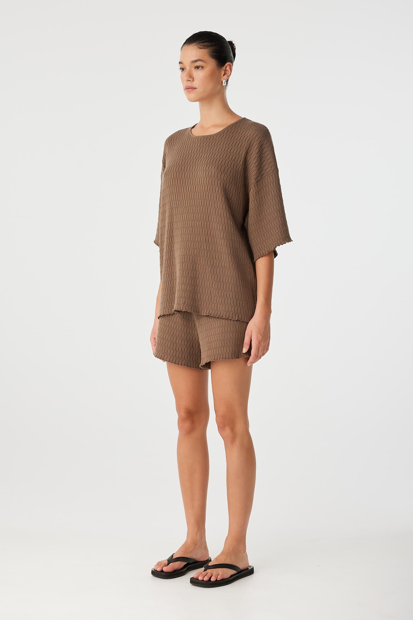 Side view of relaxed fit t-shirt in textured cacao knit, designed for movement and ease through warm days.