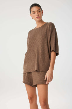 Relaxed knit set with oversized tee and matching shorts in cacao cotton, capturing a modern, textural loungewear look.