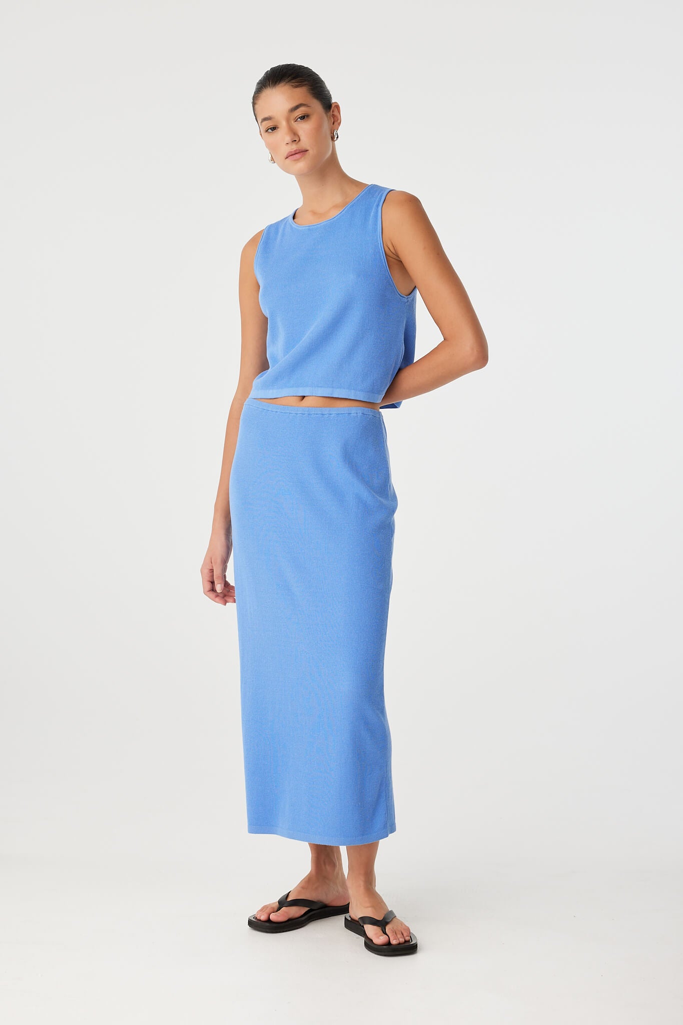 Theo Skirt styled with cropped tank for a clean summer look, featuring subtle rib texture and breathable feel.