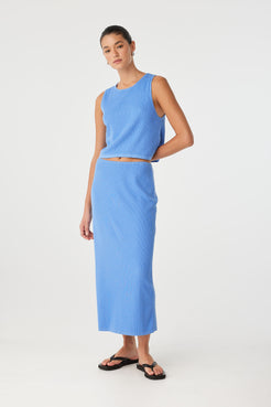 Theo Skirt styled with cropped tank for a clean summer look, featuring subtle rib texture and breathable feel.