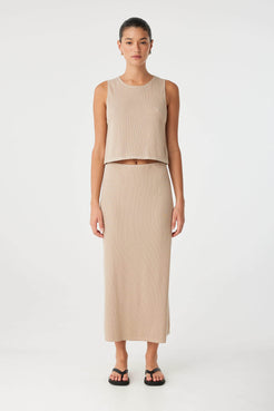 Sleeveless taupe tank styled with matching skirt in lightweight ribbed knit—ideal for elevated everyday dressing.