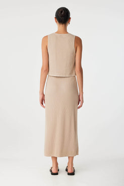 Back view of taupe ribbed tank with high neckline and soft flare—crafted from breathable natural fibres.