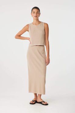 Neutral-toned knit tank with relaxed fit and rolled neckline, crafted for soft movement and breathable layering.