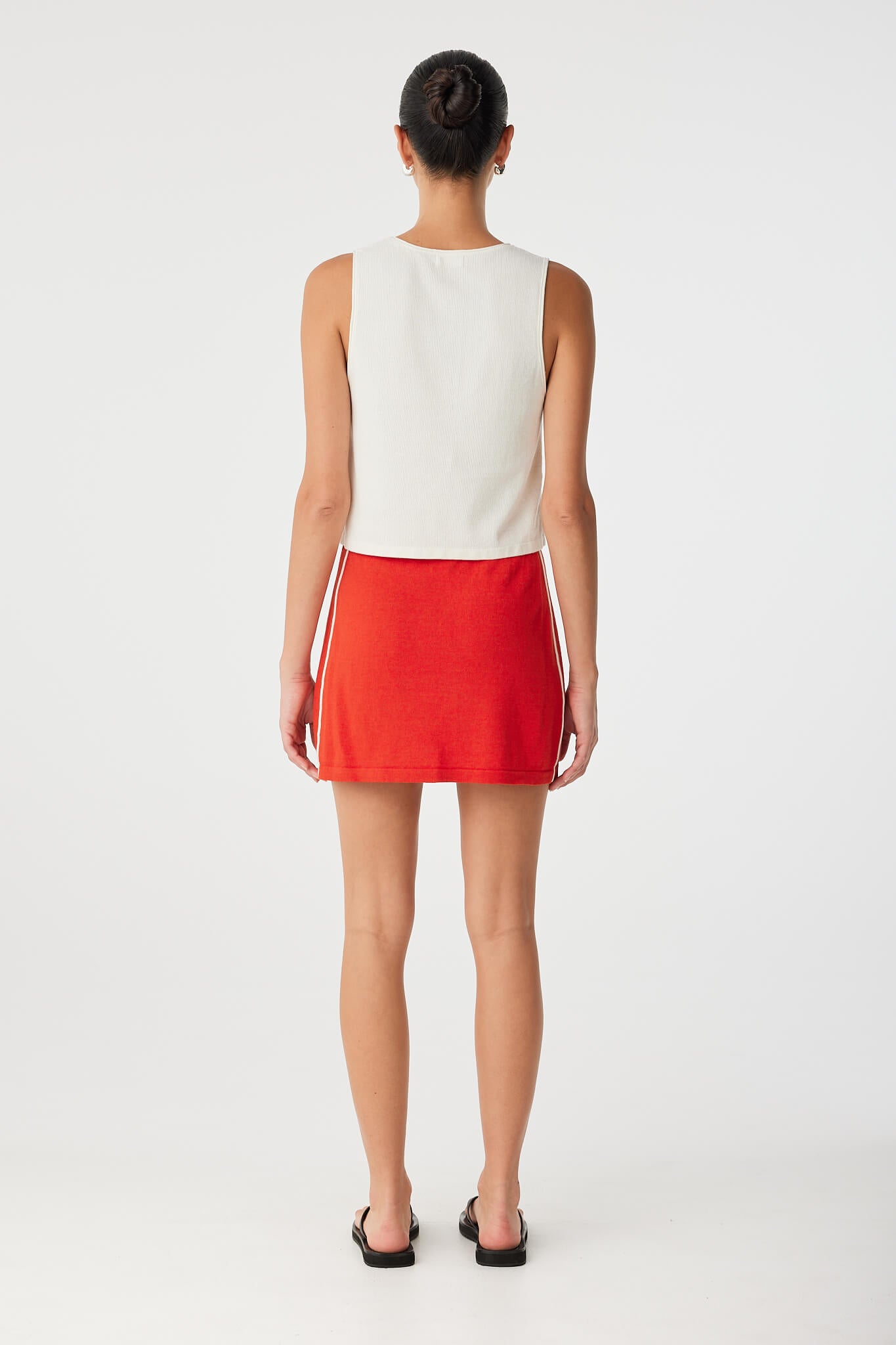 Back view of Theo Tank showing high neckline and soft ribbed texture in breathable cotton–hemp knit.