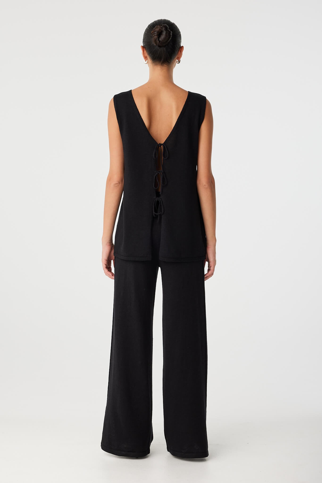 Back view of the Poppy Top worn reversed, with open back and adjustable tie closure—ideal for warm-weather styling.