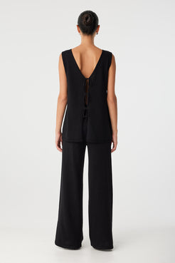 Back view of the Poppy Top worn reversed, with open back and adjustable tie closure—ideal for warm-weather styling.