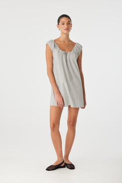Straight-on view of airy black check mini dress with keyhole neckline, relaxed silhouette and natural cotton texture.