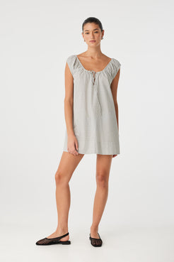 Effortless summer mini in black check cotton with a softly gathered neckline and relaxed A-line silhouette.