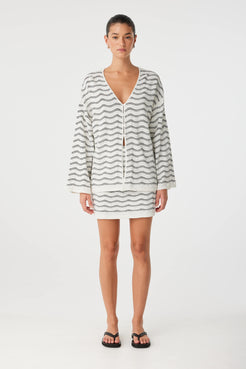 Onda Mini Skirt styled with matching wave knit top, worn as a coordinated set.