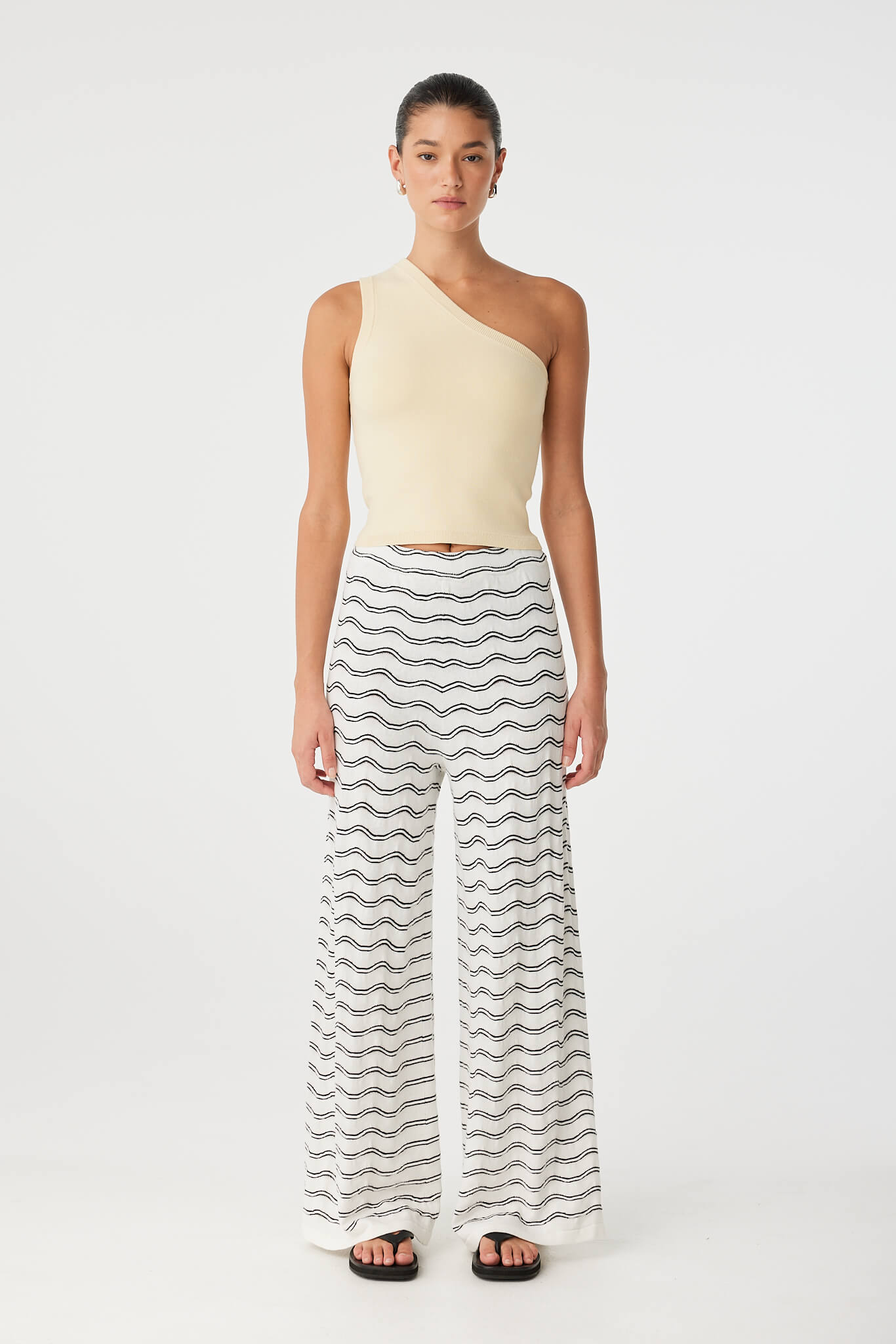 Isla Tank styled with printed wide-leg pants, showing cropped cut and sculpted fit.