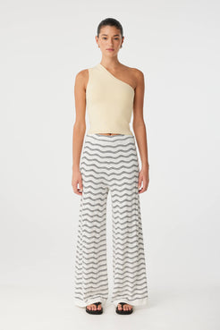 Isla Tank styled with printed wide-leg pants, showing cropped cut and sculpted fit.