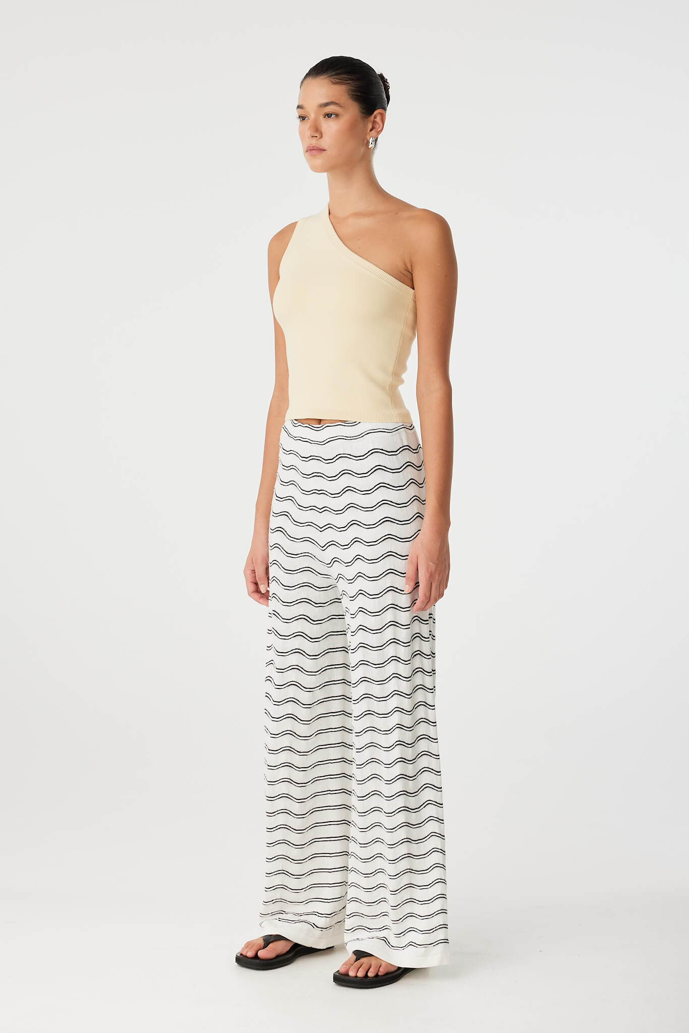 Linen blend wide-leg pant in motion, showing breathable texture and relaxed volume.