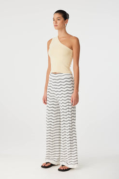 Side view of one-shoulder tank in butter organic cotton blend with soft stretch and clean line.
