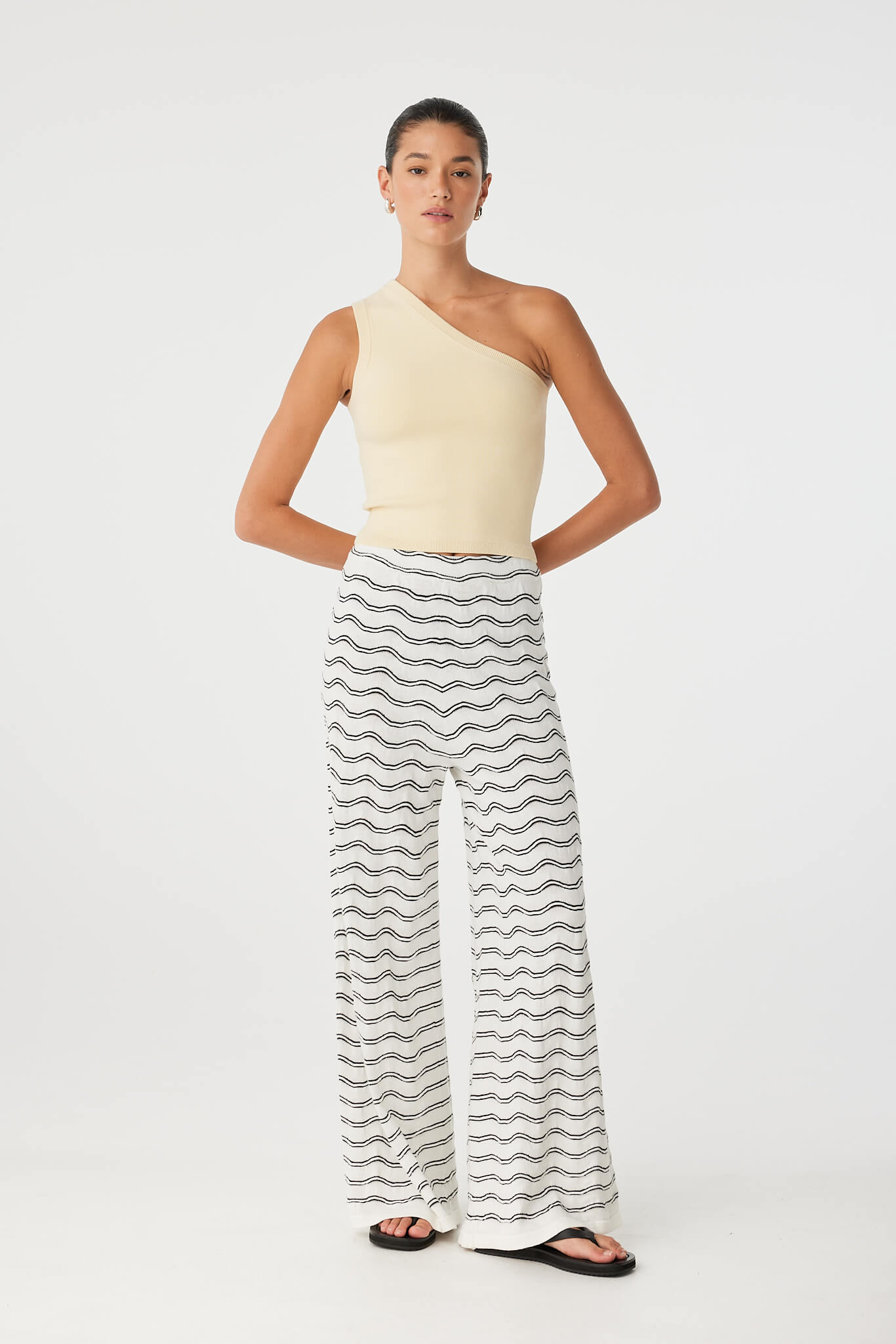 Onda Pant styled with butter one-shoulder tank, showing soft drape and fluid movement.