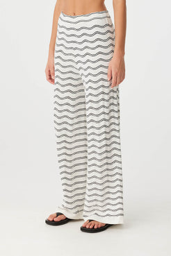 Side view of wave motif knit pant in linen blend, highlighting wide leg and waist detail.