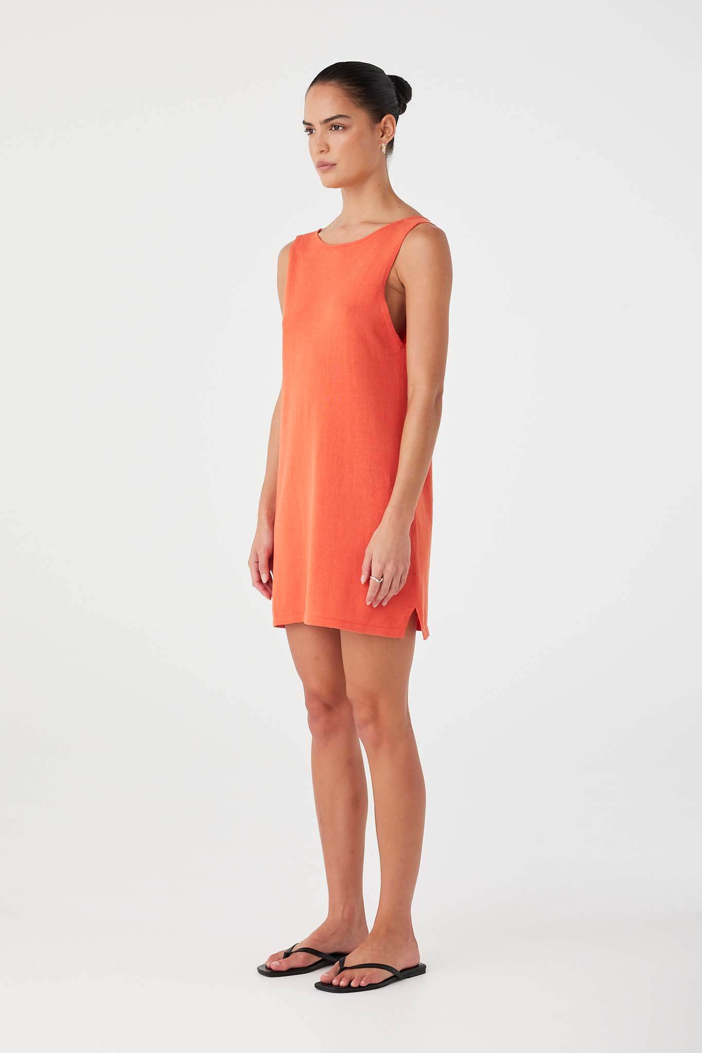 Side view of reversible mandarin mini dress in linen cotton blend with clean neckline and relaxed silhouette.