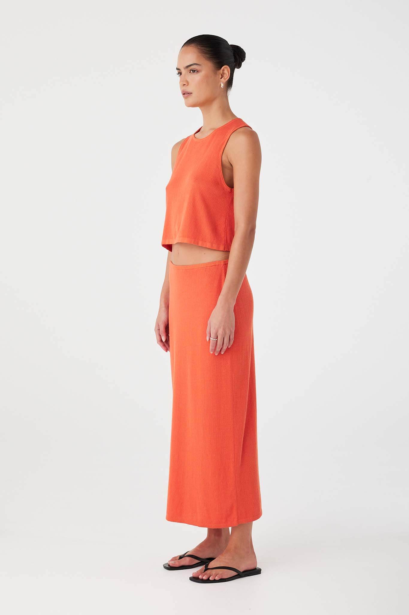 Relaxed-fit mandarin tank in soft rib knit with rolled finish and lightweight drape.