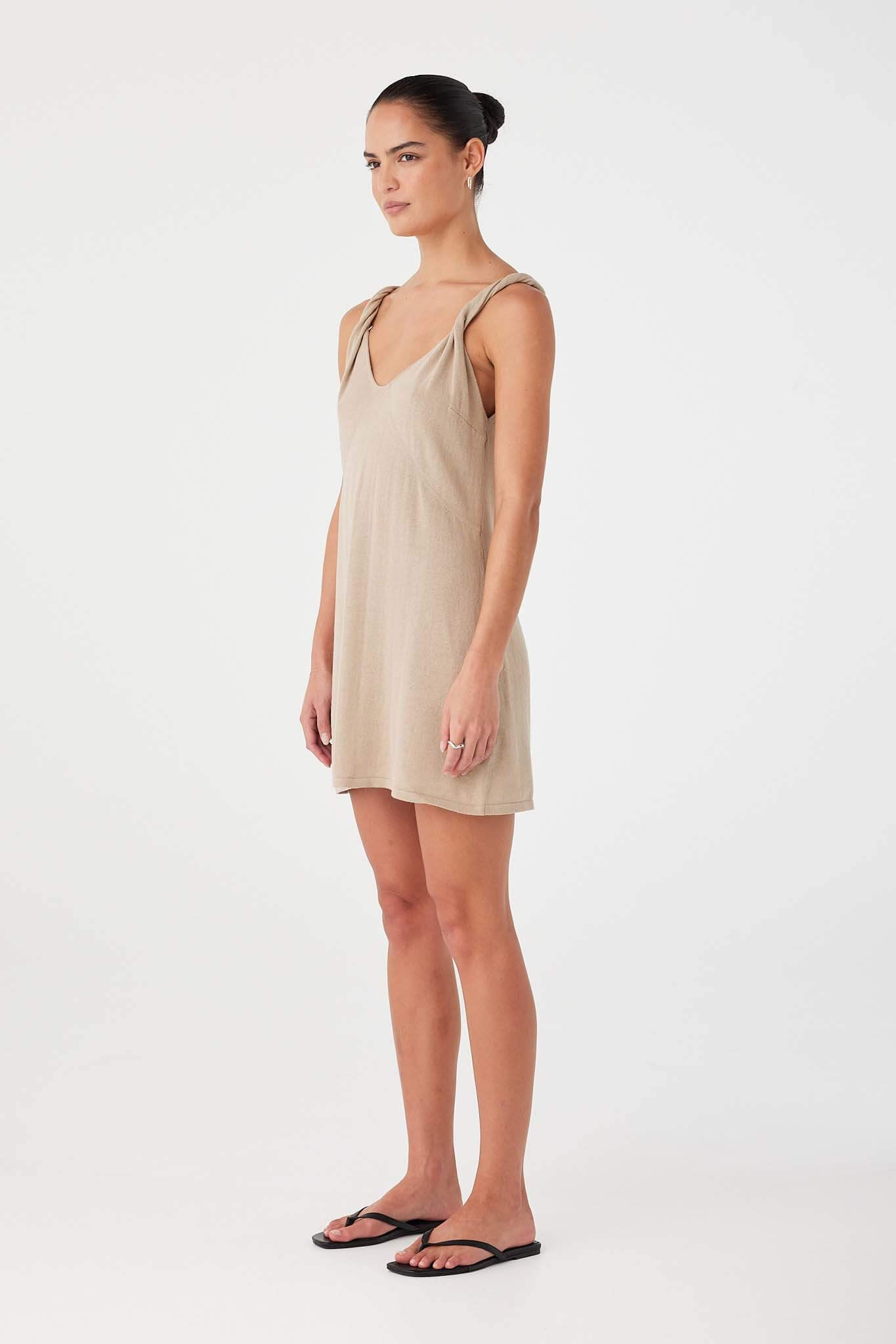 Taupe mini dress in linen organic cotton blend with shaping seams and lightweight drape.
