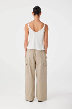 Back view of relaxed cream tank with twisted shoulder straps and straight hem, cut from breathable linen–cotton blend.