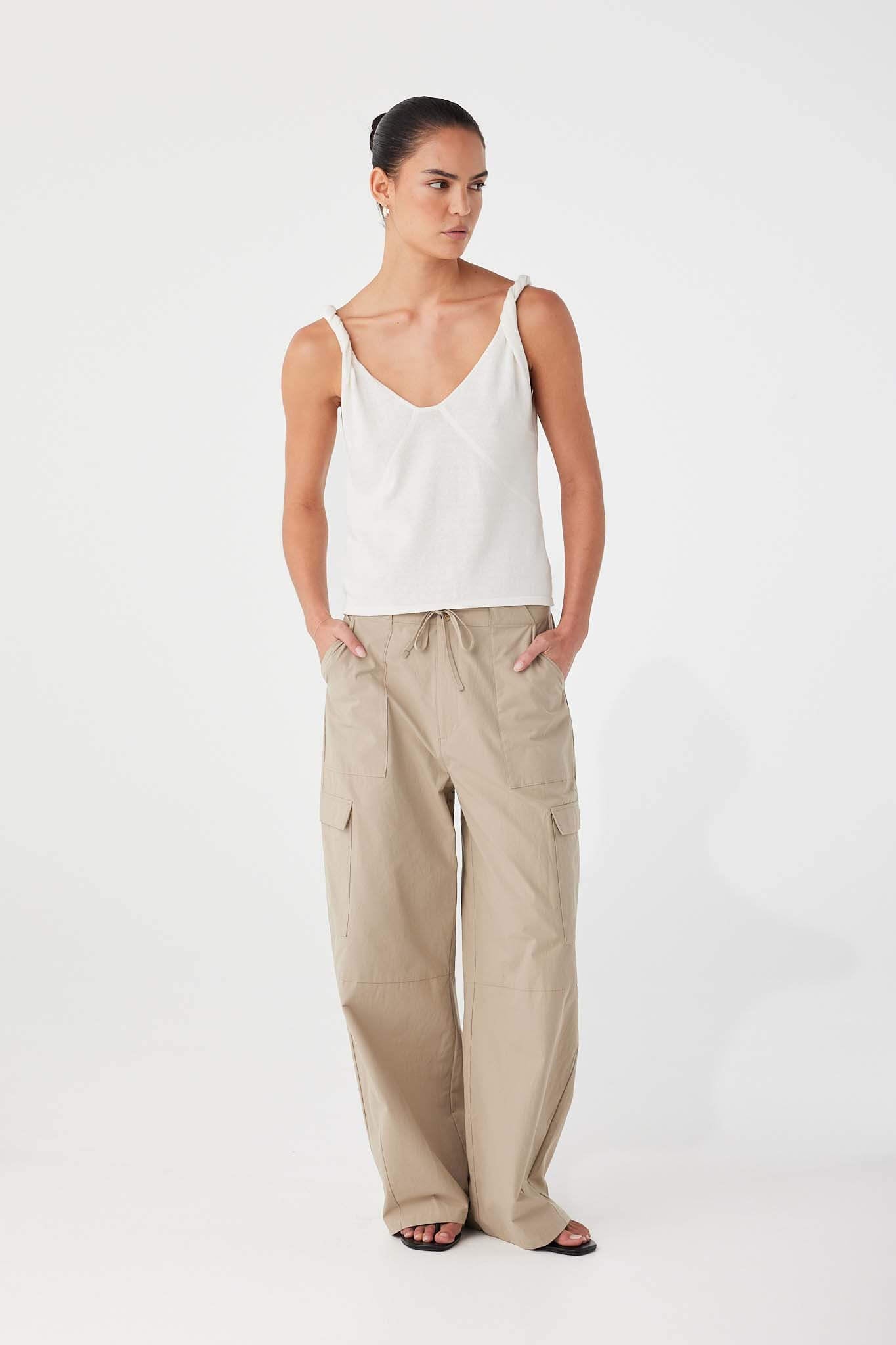 Textured cotton weave with front tie and button closure, finished with utility-style patch pockets.