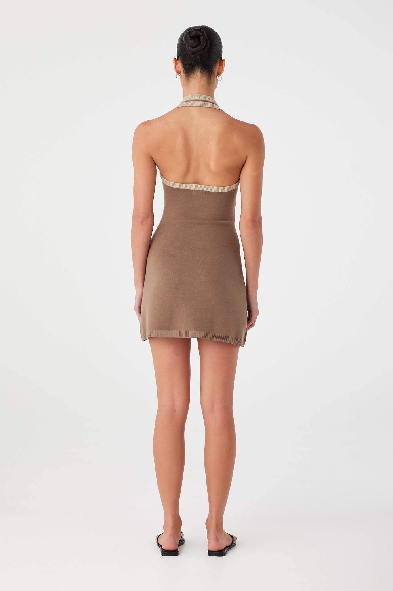 Back view of cacao halter mini dress in organic cotton blend with clean fitted drape.