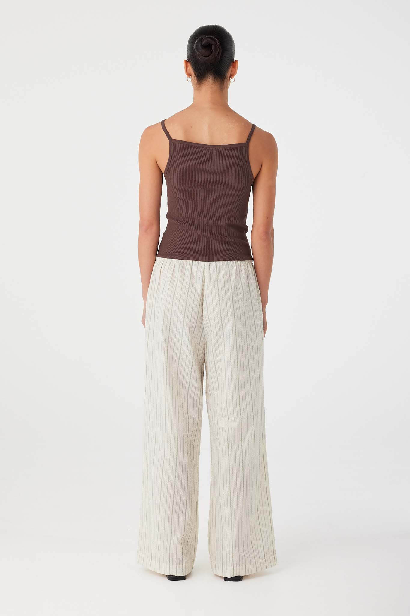 Wide-leg striped cotton pants in olive with elastic waistband and straight relaxed cut.