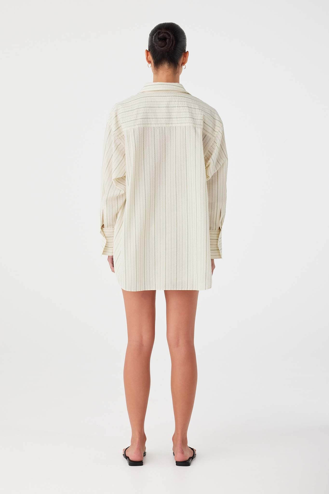 Oversized cotton shirt in olive stripe with deep pleats at back yoke for volume.