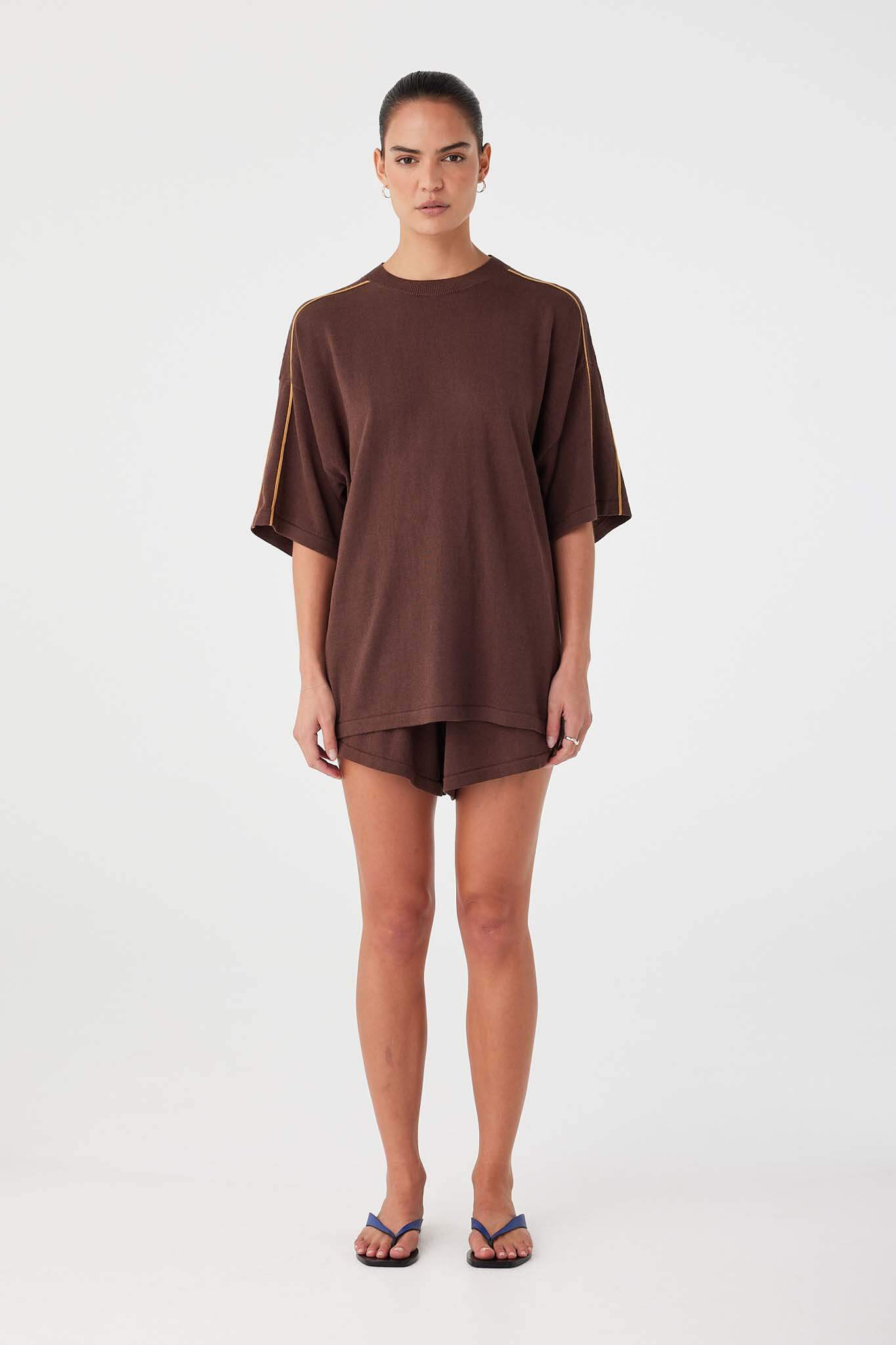 Oversized tee in espresso brown organic cotton–linen blend with slouchy fit and lightweight drape.