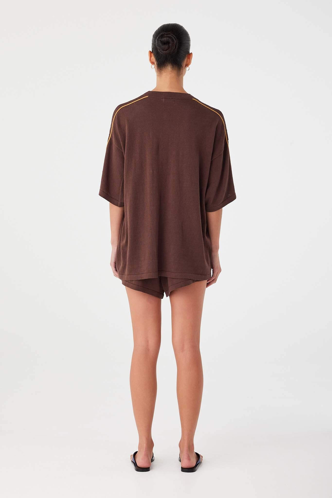 Back view of oversized espresso tee in linen–cotton blend, designed with relaxed straight drape.