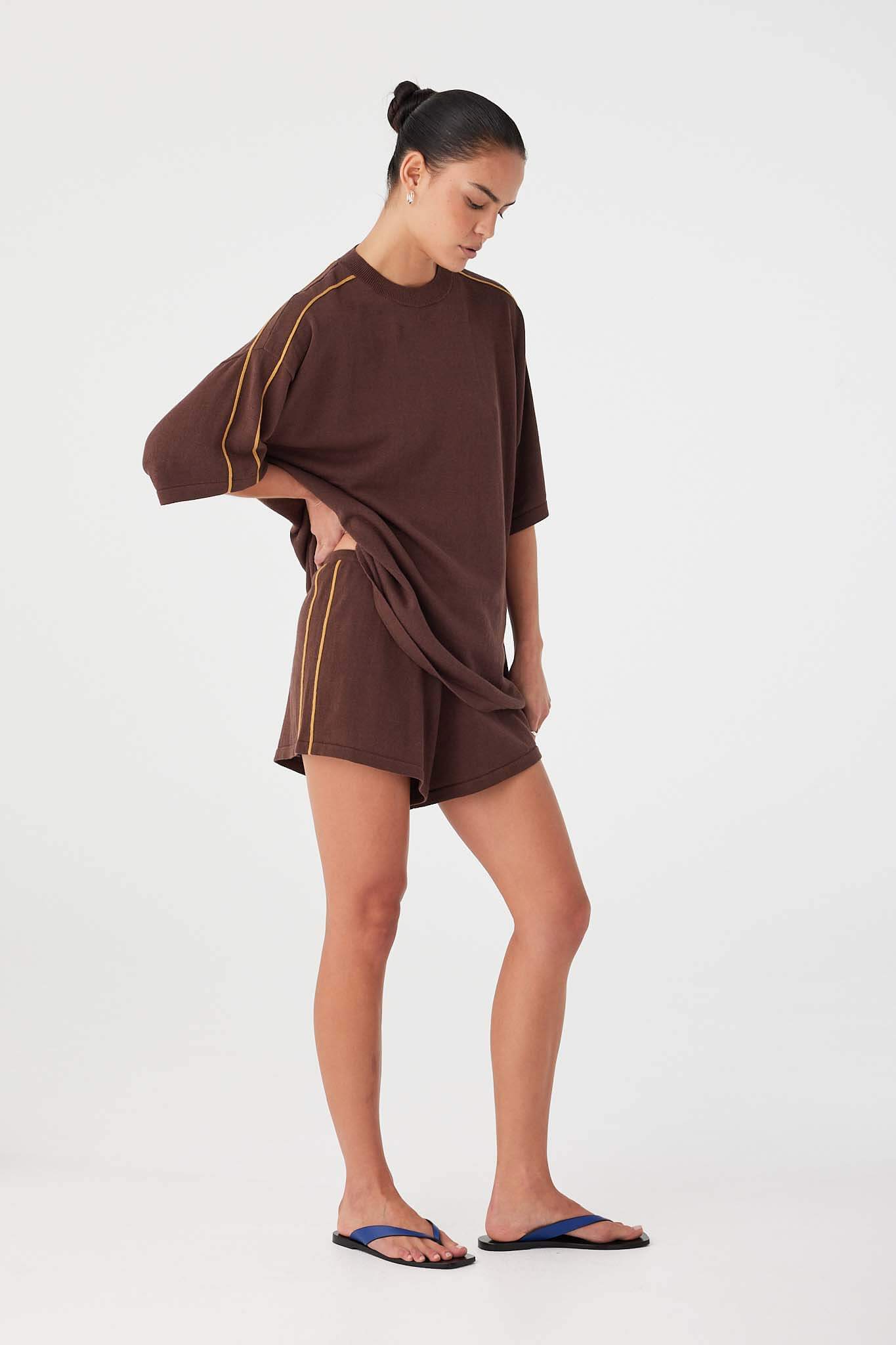Model styling espresso oversized tee with matching drawstring shorts, designed as a summer co-ord set.