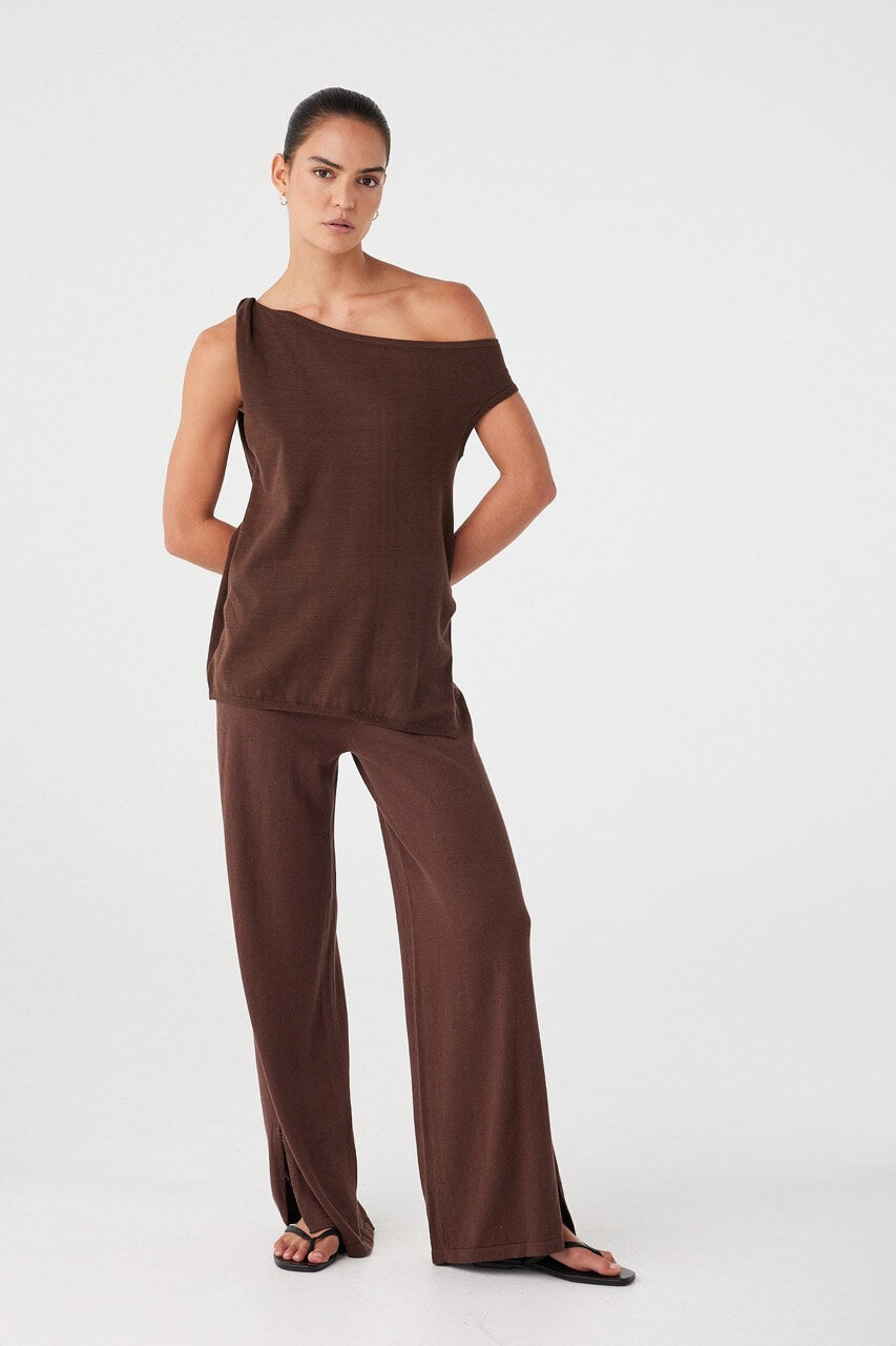 Relaxed brown asymmetric knit top styled with matching wide-leg pants, designed for effortless summer co-ord looks.