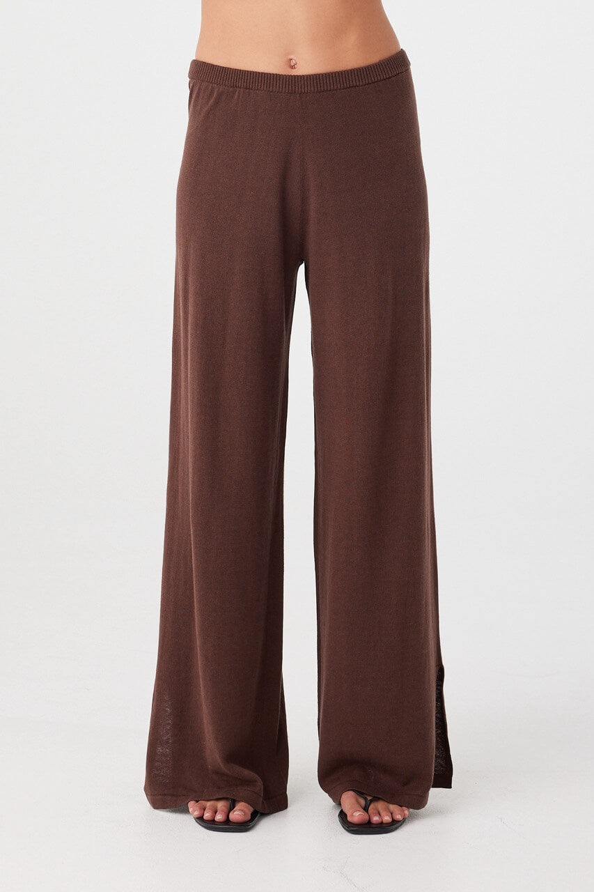 Brown cotton knit wide-leg pants with soft drape, relaxed silhouette, and lightweight texture for warm-weather ease.