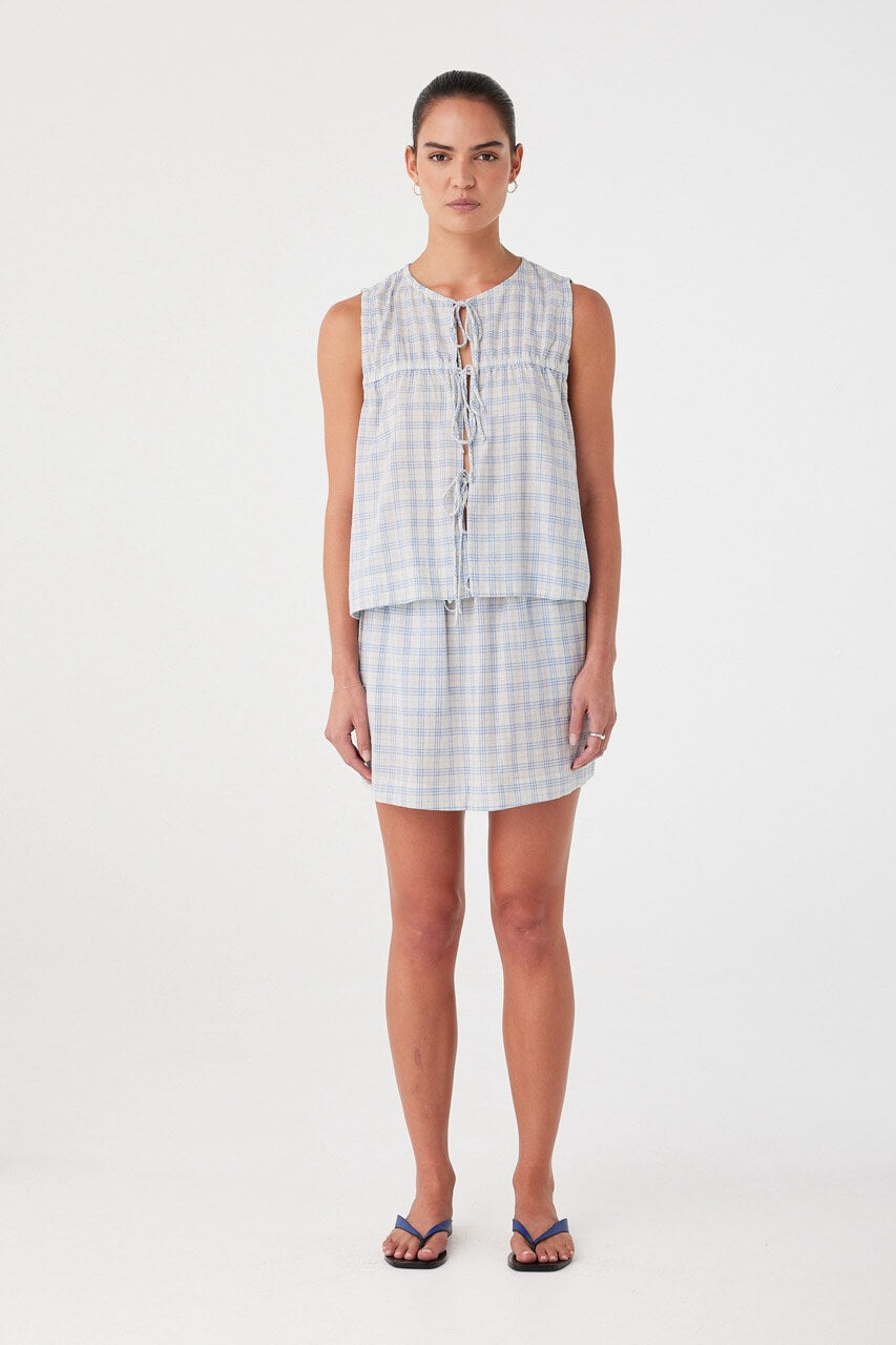 Camille Tie Top styled with matching skirt. Lightweight cotton check set with soft volume and front ties.