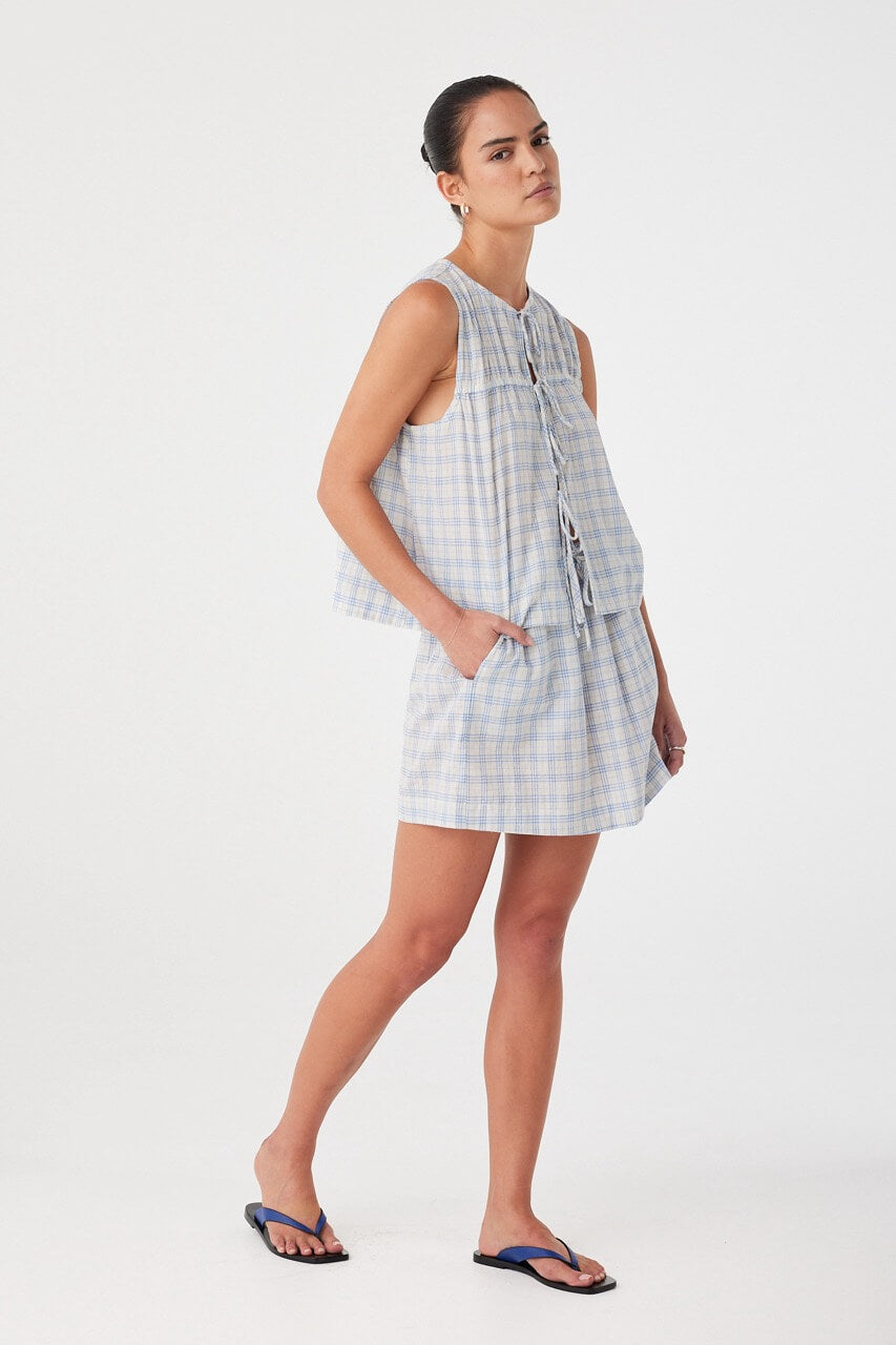 Cotton tie-front top styled casually. Soft structure with ruching and summery ease in powder blue check.