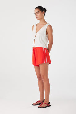 Lightweight mid-rise shorts with relaxed fit and panel detailing, ideal for summer ease.