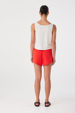 Rear view showing relaxed leg line and natural cotton-linen movement.